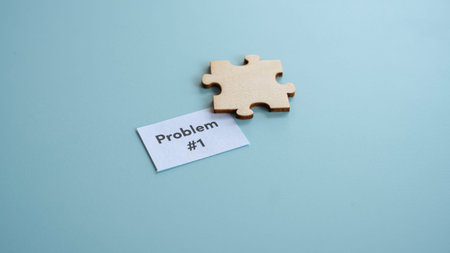 Single wooden puzzle piece next to paper labeled problem number one