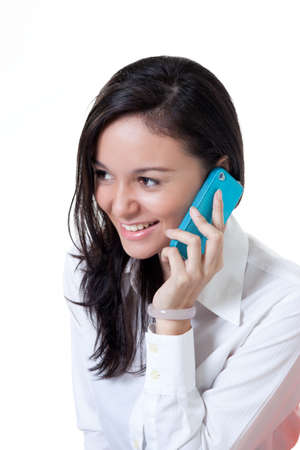 Beautiful College student talking on the with a smileの写真素材