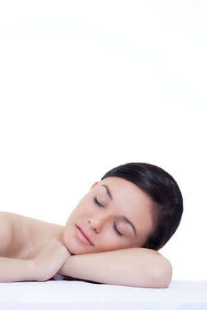 beauty of a pan asian women sleeping  on isolated white backgroundの写真素材