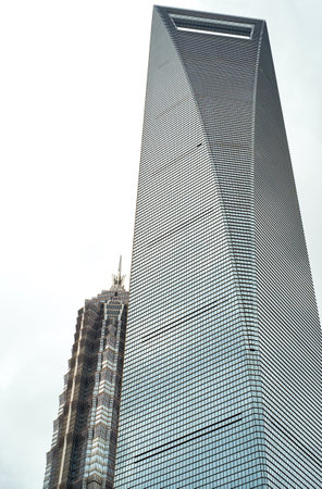 Impressive skyscrapers against gray sky in Shanghaiの写真素材