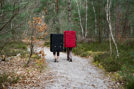 Climbers carrying their crash pad on their backの写真素材