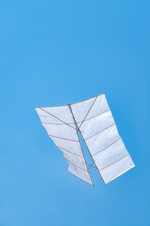 Paper kite on blue sky backgroundの写真素材