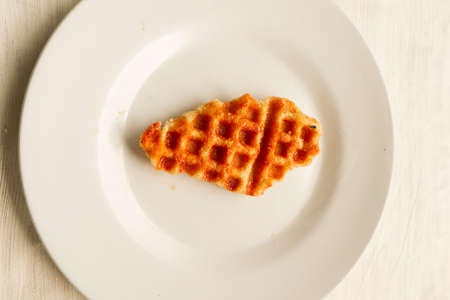 Croissant Waffle or Croffle with chocolate sauce served in box and white background