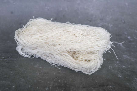 raw dry bihun or vermicelli or  rice noodles or angel hair isolated on white background