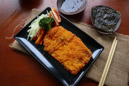 chicken katsu don is japanese food served with soy sauce on tableの写真素材
