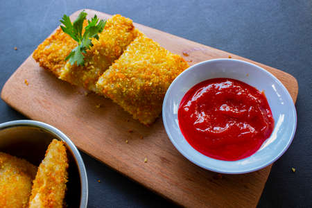 Fried Risoles or Risol Mayo are Indonesian snacks. Like Coxinha de Galinha. served with chili sauce,...
