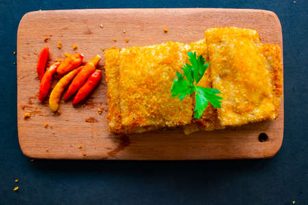 Fried Risoles or Risol Mayo are Indonesian snacks. Like Coxinha de Galinha. served with chili sauce,...