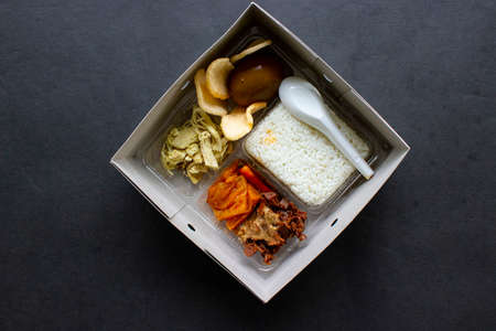 lunch boxes gudeg are similar to Bento boxes - rice boxes, rice, catering boxes, food services (rice...