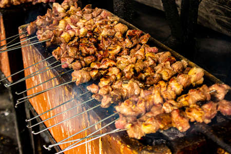 sate kambing or satay goat, lamb, Lamb or meat goat satay with charcoal  ingredient on red fire grilling. cooking satayの写真素材