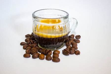 espresso served in 
glass cup with coffee bean, isolated white backgroundの写真素材