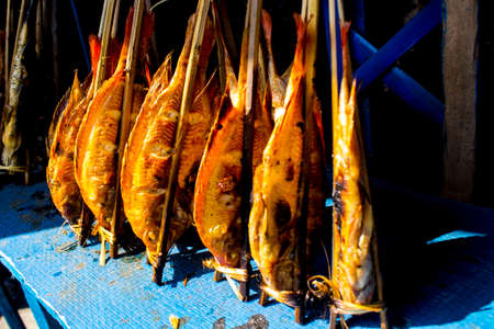 grilled fish Â Nile Tilapia on charcoal grillの写真素材