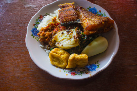 nasi tempong or tempong rice, and tempeh penyet is a typical cuisine or traditional food from the Banyuwangi area, East Java, Indonesiaの写真素材