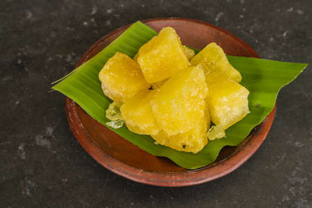 rock sugar on earthenware bowl, isolated on white backgroundの写真素材