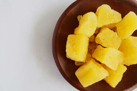 rock sugar on earthenware bowl, isolated on white backgroundの写真素材