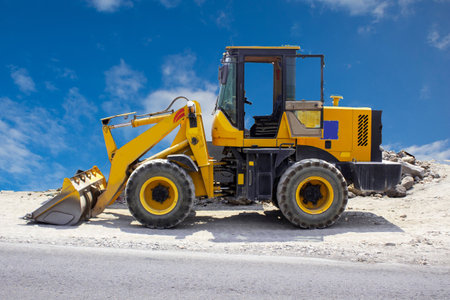 excavator or backhoe on construction site and sky background