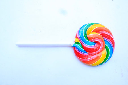 lollipop, Colorful rainbow lollipop swirl on plastic stick isolated on white background