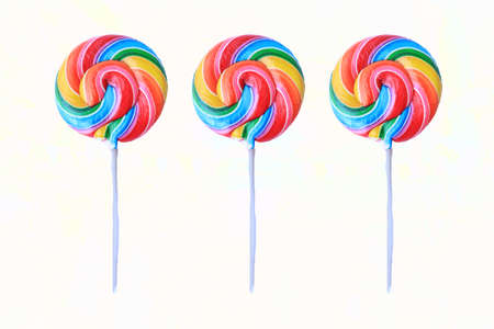 lollipop, Colorful rainbow lollipop swirl on plastic stick isolated on white backgroundの写真素材