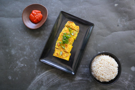 Telur dadar gulung or Tamagoyaki or Japaneses egg roll. Gyeran Mari or Korean Rolled Omelette. fried eggの写真素材