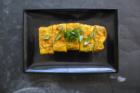 Telur dadar gulung or Tamagoyaki or Japaneses egg roll. Gyeran Mari or Korean Rolled Omelette. fried eggの写真素材