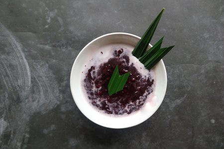black sticky rice porridge in a bowl. bubur ketan hitamの写真素材