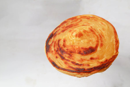 paratha bread or canai bread or roti maryam, favorite breakfast dish. on white background