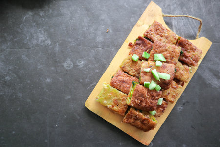 Martabak Telor or Murtabak Telur or mutabbaq. Savory pan-fried pastry stuffed with egg, meat and...