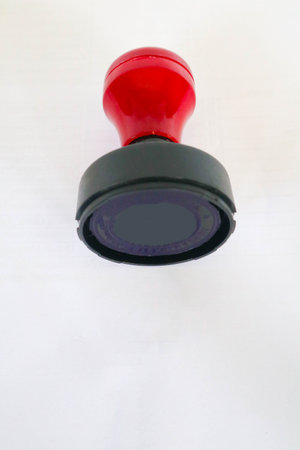 Stamp, modern Stamp, Red Handle Rubber Stamp Top View Isolated on White Background.の写真素材