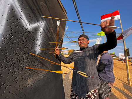 Klaten, Indonesia, august 15, 2023. male and female participants, dressed in Javanese custom pulled...