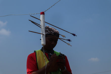 Klaten, Indonesia, august 15, 2023. male and female participants, dressed in Javanese custom pulled...