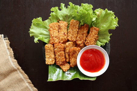 Tempeh, Tempe Goreng or Fried tempeh is Indonesia traditional food, made from fermented soybean...