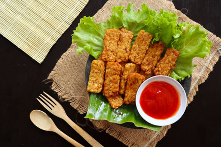 Tempeh, Tempe Goreng or Fried tempeh is Indonesia traditional food, made from fermented soybean...