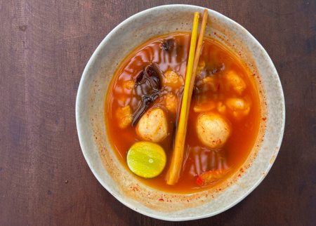 Tom yam soup originating from Thailand. Tom yum is made with shrimp, chili, lime, chicken, fish, or...