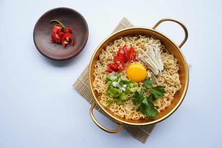 Ramyeon or Ramyun is Korean instant noodle, with spicy flavour topped with egg yolk, chilli,...