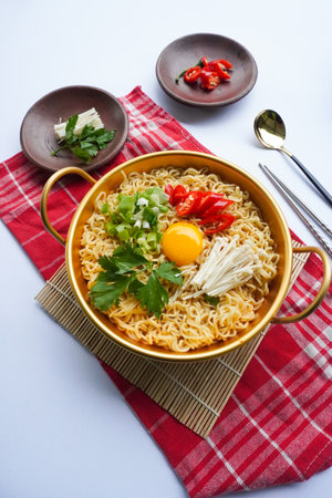 Ramyeon or Ramyun is Korean instant noodle, with spicy flavour topped with egg yolk, chilli,...