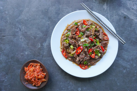 Bulgogi is a Korean food made from beef grilled with sauce and spices. on black backgroundの写真素材