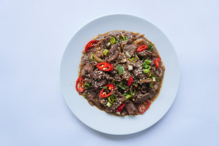 Bulgogi is a Korean food made from beef grilled with sauce and spices. on white backgroundの写真素材
