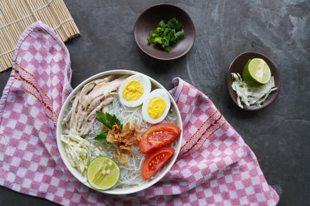 soto ayam bening or chicken soup is Indonesian food, made from rice, chicken broth, shredded...