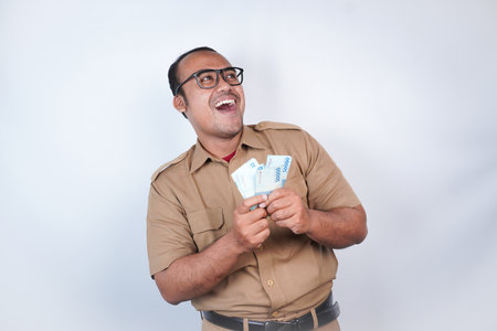 a man Asian civil servants or state civil servants is with brown uniform. gesturing happy to get...