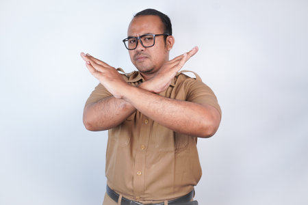 a man Asian civil servants or state civil servants is with brown uniform. gesture pose rejection or...