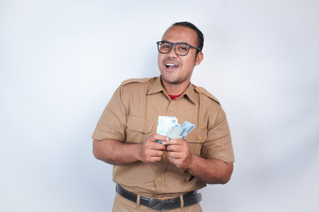 a man Asian civil servants or state civil servants is with brown uniform. gesturing happy to get...