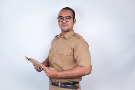 a man Asian civil servants or state civil servants is with brown uniform. gesturing bringing...