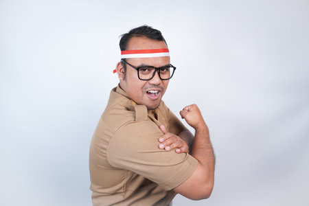 a man Asian civil servants or state civil servants is with brown uniform and red and white Headband...