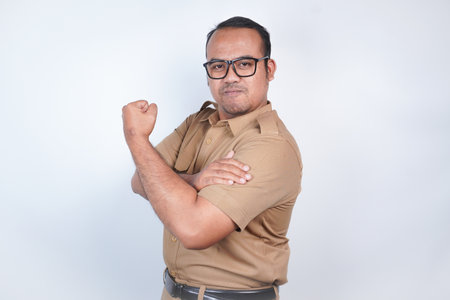 a man Asian civil servants or state civil servants is with brown uniform. gesture showing strong...