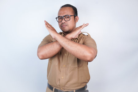 a man Asian civil servants or state civil servants is with brown uniform. gesture pose rejection or...