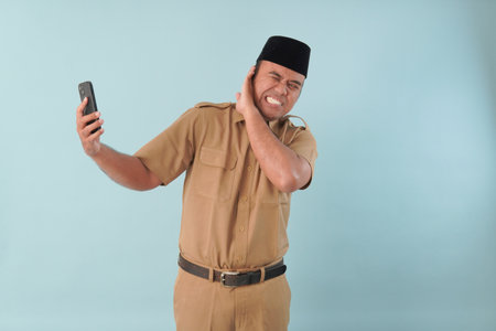 government worker man wearing is talking on his cell phone. He is smiling and he is enjoying PNS,...