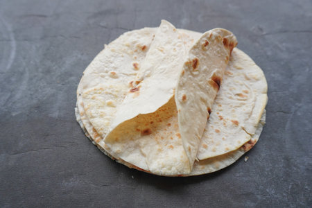 Flour Tortilla Wraps Homemade wheat tortillas, pita bread, tortilla, pita with ingredients for cooking on table. Top view. The concept of homemade food.の写真素材