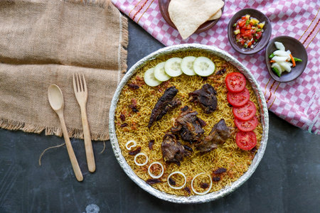 Traditional Kebuli Rice with Lamb, aromatic spiced rice dish cuisine, served with tender meat,...