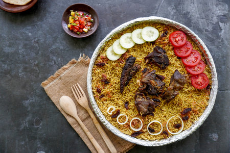 Traditional Kebuli Rice with Lamb, aromatic spiced rice dish cuisine, served with tender meat,...