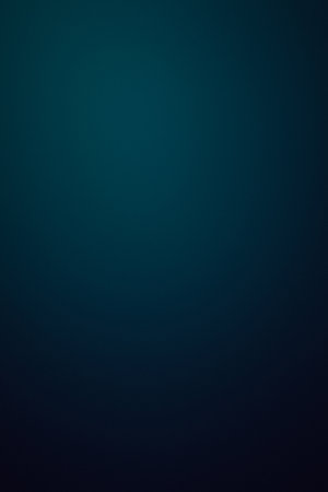 A blue background with a white dot in the middle. The background is a deep blue color and the white dot is smallの写真素材