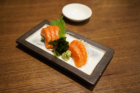 Salmon sashimi Japanese food with wasabi on white plateの写真素材